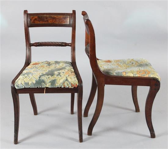 A set of four Regency mahogany and brass inlaid dining chairs